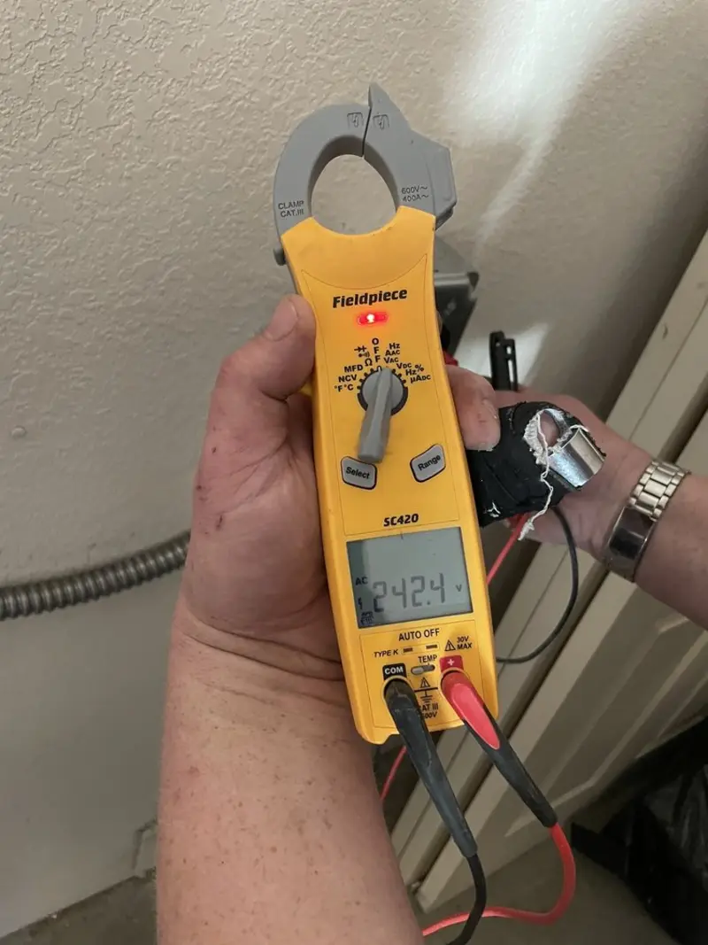 Voltage testing with clamp meter during Ceiling Fan Installation in Pulaski